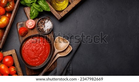Rich homemade tomato sauce and ingredients. Flat lay with copy space