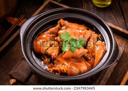 braised pig's trotters （Pork Hock，pig feet） with brown soya sauce, rice wine vinegar. chinese food Royalty-Free Stock Photo #2347983445