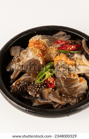 Soy Sauce Marinated Crab on a plate Royalty-Free Stock Photo #2348000329
