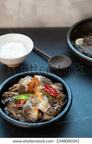 Soy Sauce Marinated Crab on a plate Royalty-Free Stock Photo #2348000341