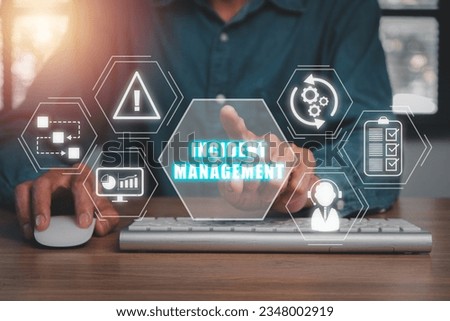 Incident Management process Business Technology concept, Business person hand touching incident management icon on virtual screen. Royalty-Free Stock Photo #2348002919