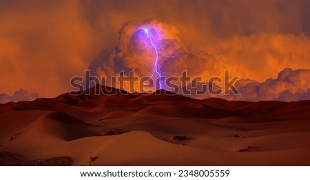 Sand dunes and sand storm in the Sahara desert with lightning - Hot and dry desert landscape Royalty-Free Stock Photo #2348005559