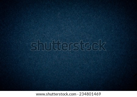 Graphite flat cardboard texture abstract with dark vignette, paper plain grainy smooth surface background in horizontal orientation, nobody.