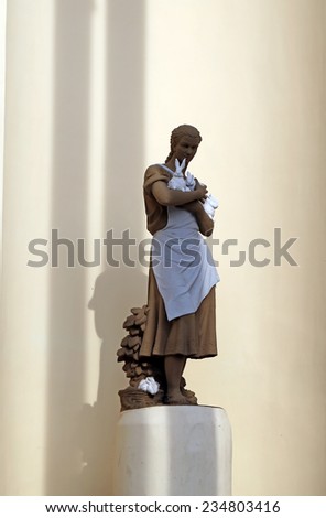 Statue of a girl with a rabbit in the exhibition pavilion building rabbit at ENEA in Moscow