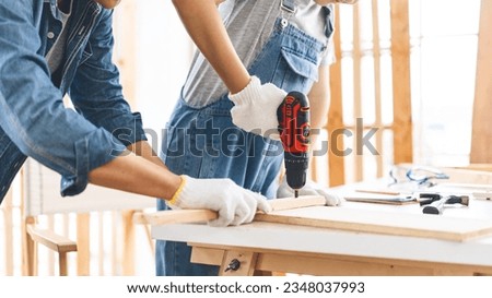 Closed up hand father and son tech carpenter skill. Homeschooling with parent family concept. Kid study home skill lifestyles activity. Royalty-Free Stock Photo #2348037993