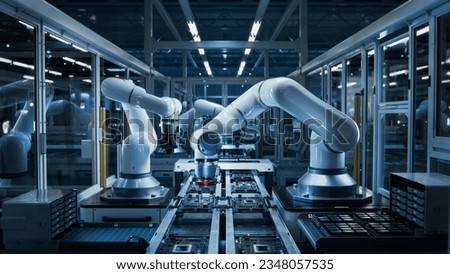 Manufacturing Automation. Advanced High Precision Robot Arms on Automated PCB Assembly Line Inside Modern Electronics Factory. Electronic Devices Production Industry. Component Installation Process. Royalty-Free Stock Photo #2348057535