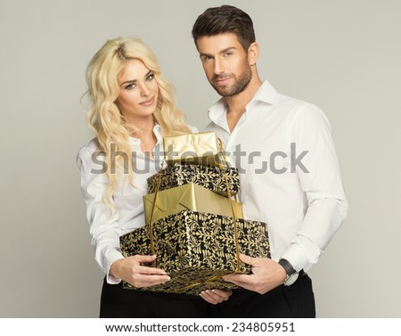 Beautiful young couple with presents