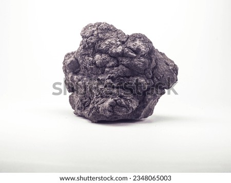 Lava rock on a white background, originates from volcanic eruptions,often used as an aquatic or non-aquatic decoration