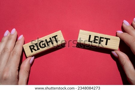 Right or Left symbol. Concept word Right or Left on wooden blocks. Businessman hand. Beautiful red background. Business and Right or Left concept. Copy space