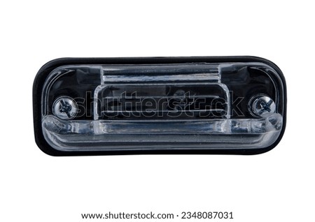 Close-up on an isolated generic rear light of a car and truck taillight optical equipment with a lamp inside on a white isolated background. Spare part for auto repair in a car workshop.  
