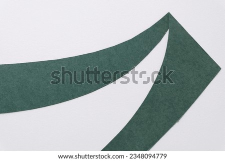 abstract wave or two pieces of green paper on white