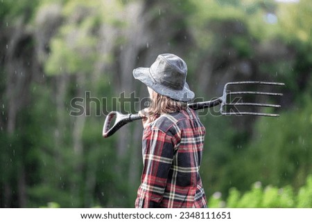 female gardener with a pitchfork in the netherlands