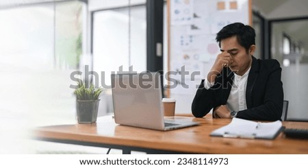 Overworked businessperson financier while working are stress the outcome Royalty-Free Stock Photo #2348114973