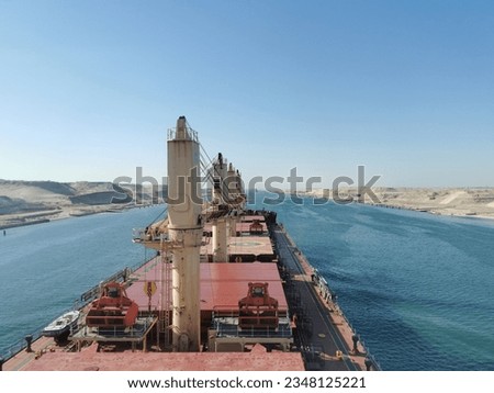 The​ ship​ transit suez canal​ around of​ canal​ be​ full​ of​ desert Royalty-Free Stock Photo #2348125221