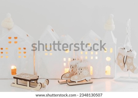 christmas toy houses on vintage  shelf  on white background