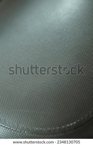 rough texture of an abstract dot pattern found on the surface of a motorbike seat, can be used as an abstract background