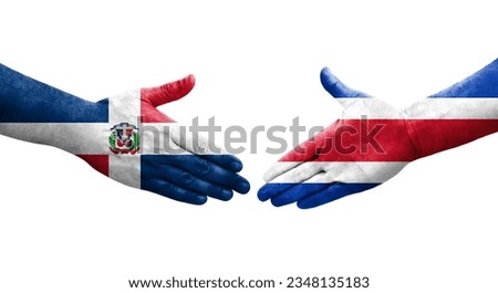 Handshake between Costa Rica and Dominican Republic flags painted on hands, isolated transparent image.