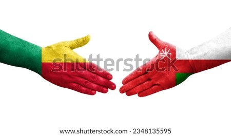 Handshake between Benin and Oman flags painted on hands, isolated transparent image.