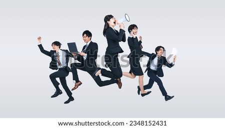 A group of  jumping young business people.
