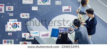 Multinational businesspeople and engineers meeting in lobby and data statistics concept. Royalty-Free Stock Photo #2348152491