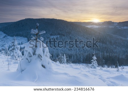 Winter landscape at sunset in mountains 