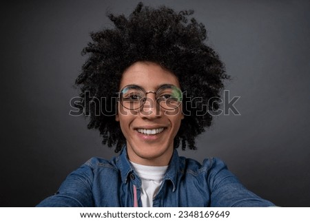 Young guy making selfie and looking excited