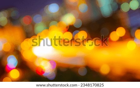 Abstract defocused city street scene at night