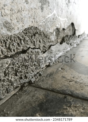 Cracked tiles and wall Indian homes photo