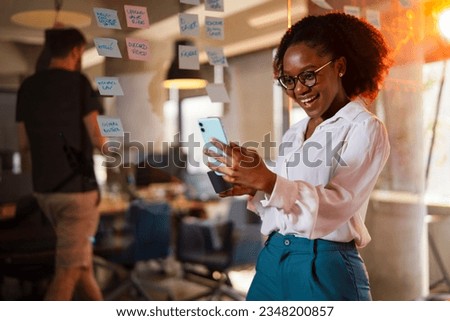 Happy businesswoman in office. Portrait of beautiful businesswoman using the phone. Businesswoman having video call.  Royalty-Free Stock Photo #2348200857