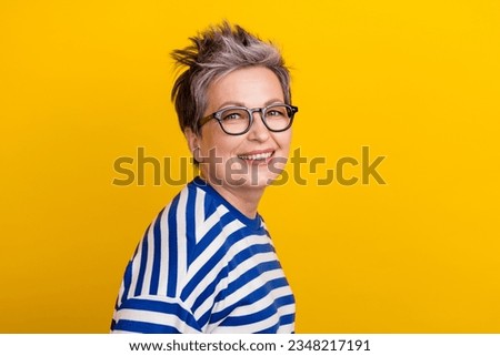 Portrait of young beautiful businesswoman striped blue pullover dyed short haircut lady posing magazine isolated on yellow color background Royalty-Free Stock Photo #2348217191