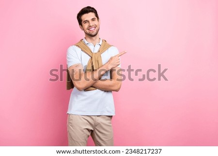 Photo of attractive satisfied man entrepreneur wear trendy clothes arm demonstrate empty space billboard isolated on pink color background
