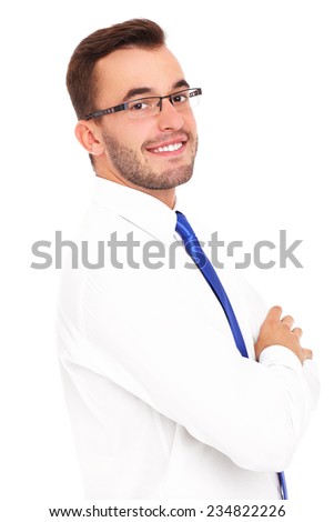 A picture of a young confident businessman posing over white background