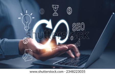 strategy, goal, success, target, aim, futuristic, marketing, performance, achievement, choose. typing at keyboard and then hand of palm holds the trophy, strategy, light bulb, target symbolic showing.