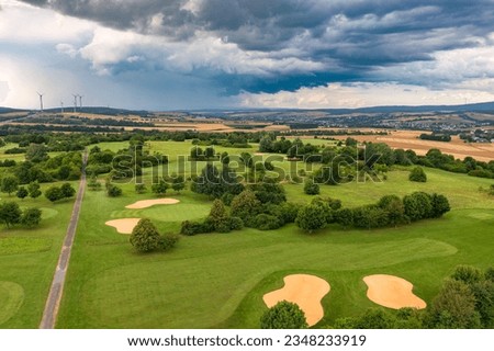 Huge storm clouds over a golf course in Taunus - Germany