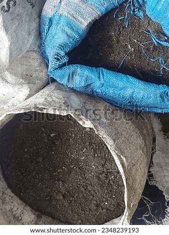 Sacks containing soil in the soil there are worms which are used as fertilizer