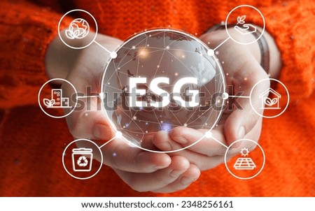 ESG environmental social governance business strategy investing concept. Woman holding  world ball with Esg icons.Ethical and sustainable investing. Enhance ESG alignment of investments.