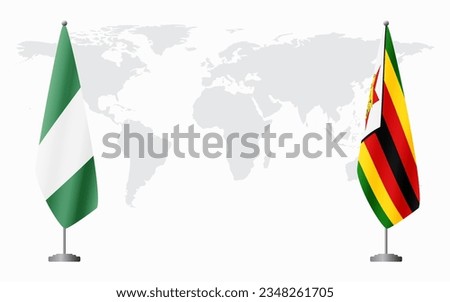 Nigerian and Zimbabwe flags for official meeting against background of world map.