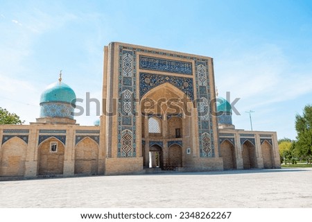 View of Hazrati Imam Mosque and Muyi Muborak Madrasah (Moyie Mubarek Library Museum) in Tashkent, Uzbekistan. Translation on mosque: "The Hazrati Imam"