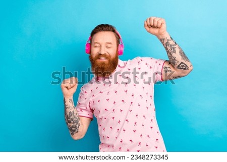 Photo of cool overjoyed person closed eyes enjoy favorite song dancing chilling isolated on blue cool background