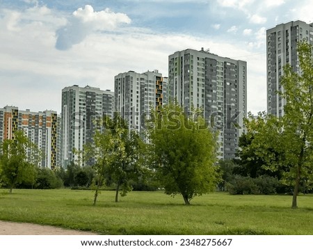 Saint Petersburg, Russia, august 12, 2023.  Multi-storey modern residential buildings near the park 