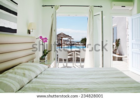 hotel room with bed and view swimming pool