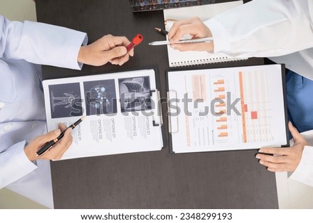 The doctor joins a meeting with the surgeon's team to discuss a plan for cancer surgery after the medical team detects cancer. Collaborative concept of a team doctors and surgeons in surgery.
 Royalty-Free Stock Photo #2348299193