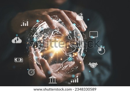 Tech driven Global Business, Businessman embraces technology as he analyzes big data for business intelligence. composition of world map digital links emphasizes interconnectedness of global market. Royalty-Free Stock Photo #2348330589