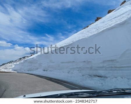 High Snow Wall on Side of Highway to Pike's Peak Summit in Colorado