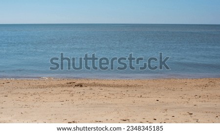 the shore with the waves of the warm Sea of Azov in the village of Bezymennoye Donetsk region