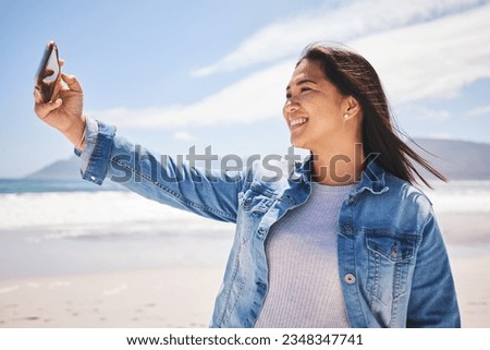 Phone, selfie and happy woman on beach for holiday, vacation or summer in Indonesia or profile picture for social media. Person, smile and post memory of the ocean, sea or relax in nature for break