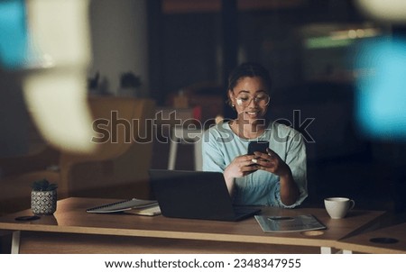 Woman in dark office with phone, typing or reading email, message or social media post connectivity. Late night at work, cellphone and girl at desk networking, online chat or writing text at overtime