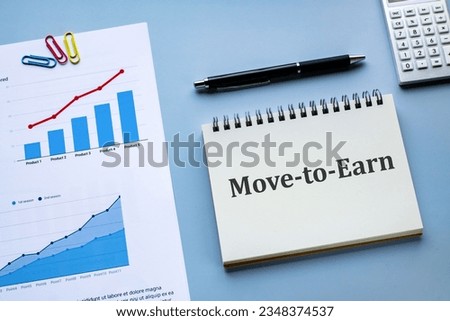There is notebook with the word Move-to-Earn. It is as an eye-catching image.
