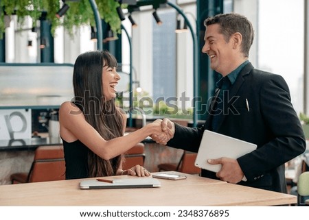 businessman and businesswoman shake hands congratulate in reaching an agreement, business, smiling face.