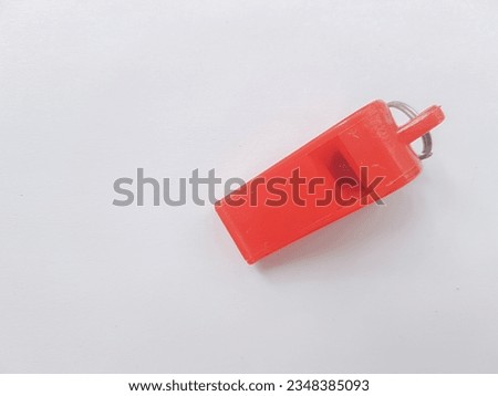 red whistle on white isolated background 
